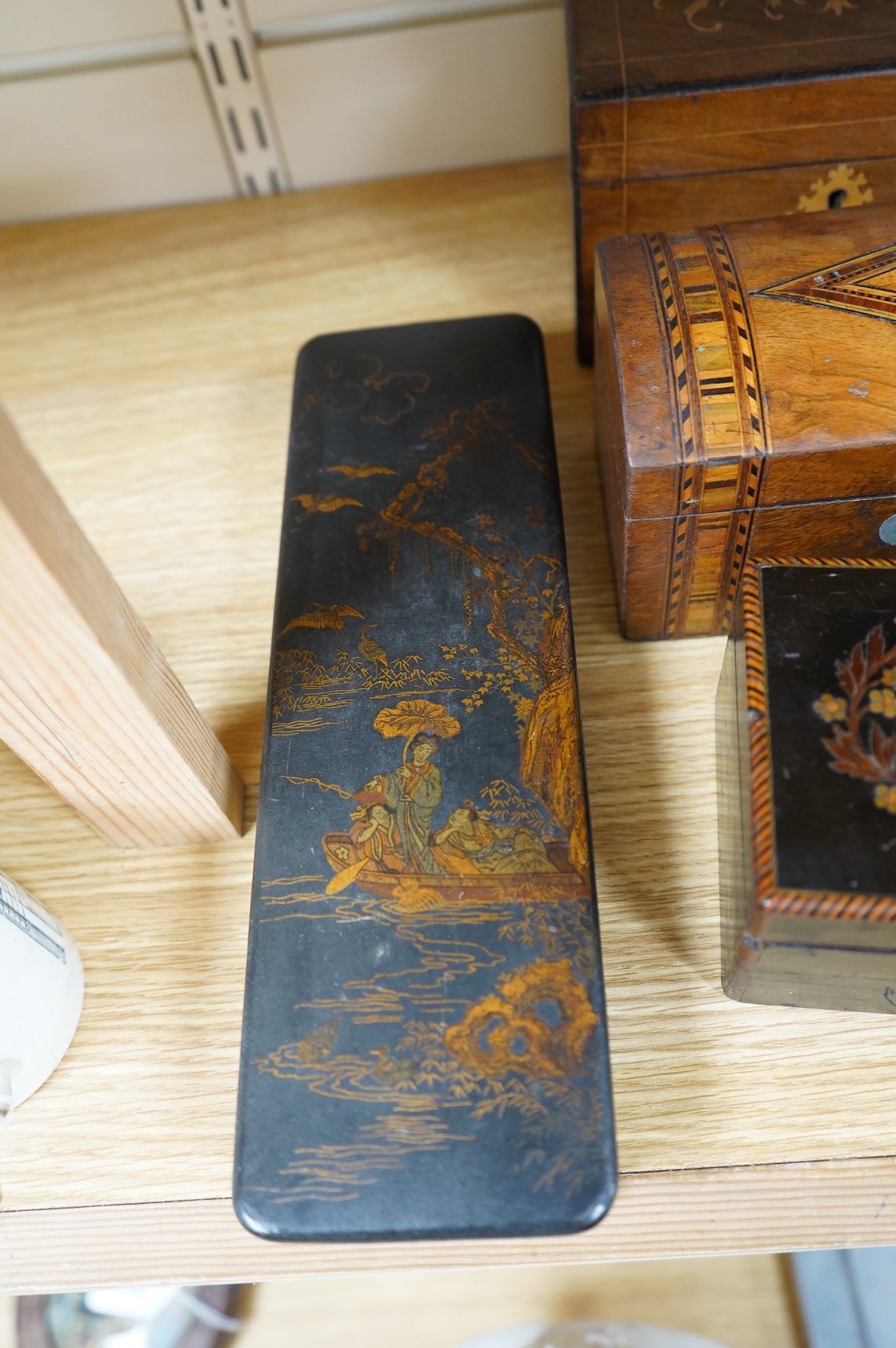 A blonde tortoiseshell veneered box, six other boxes and a miniature bagatelle board